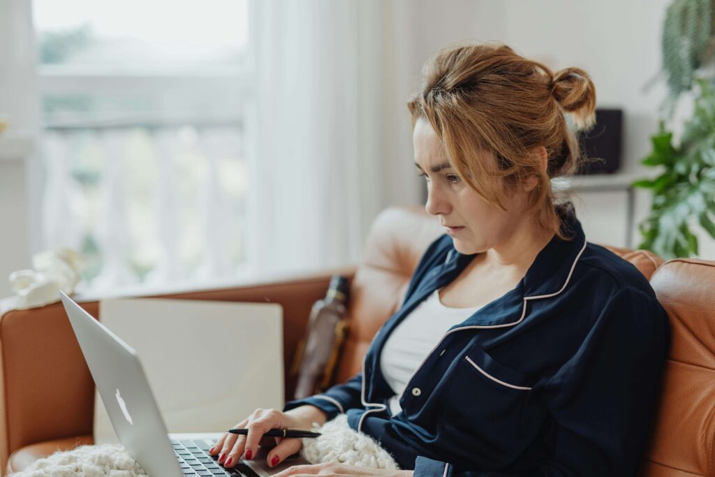 woman researching on laptop