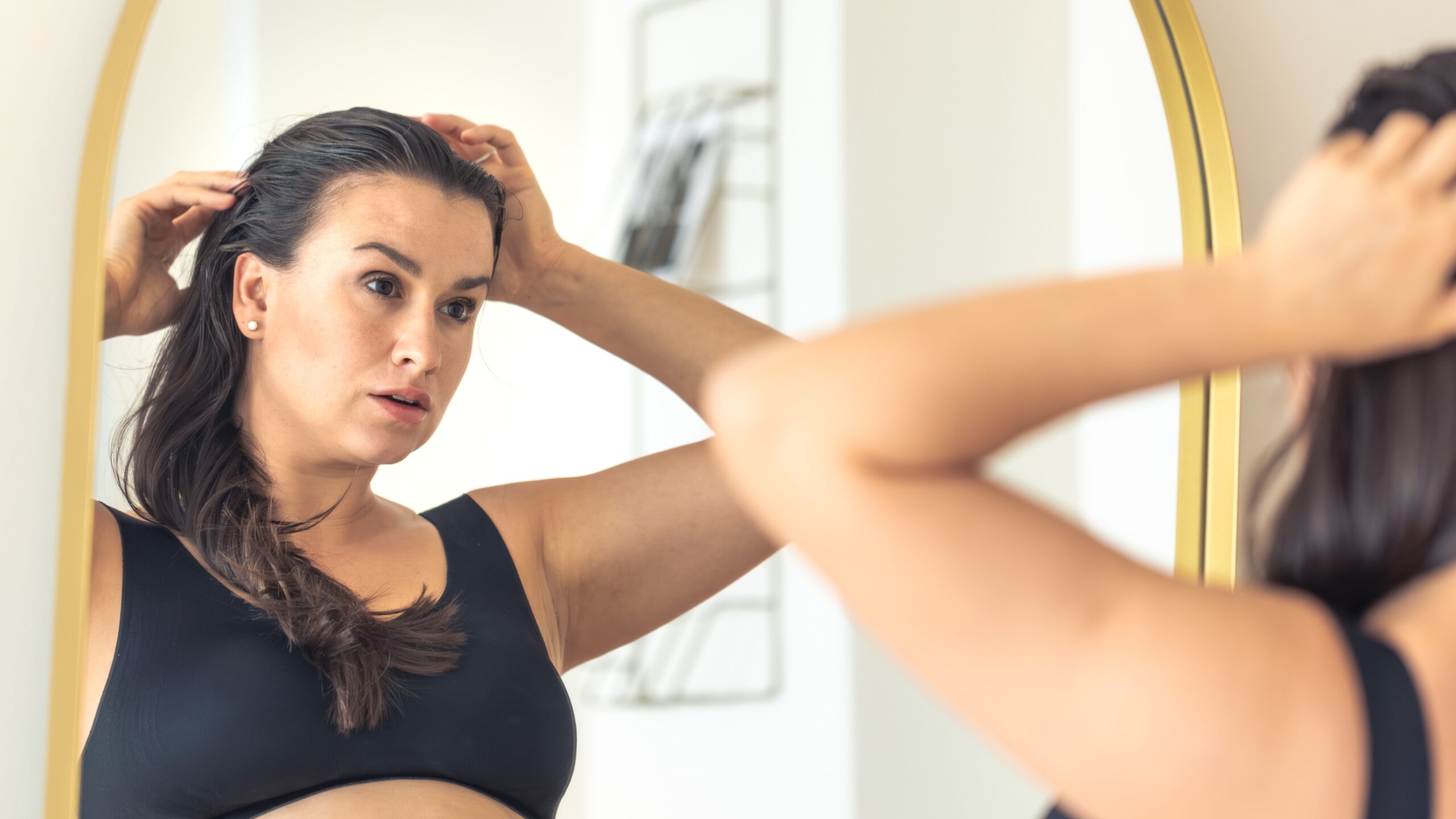 Postpartum Hair Shedding: What’s Normal and What Needs a Dermatologist